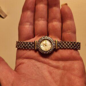Anne Klein Vintage Gold-Tone Womens Watch With Diamond-Accented Bezel & Roman Nu